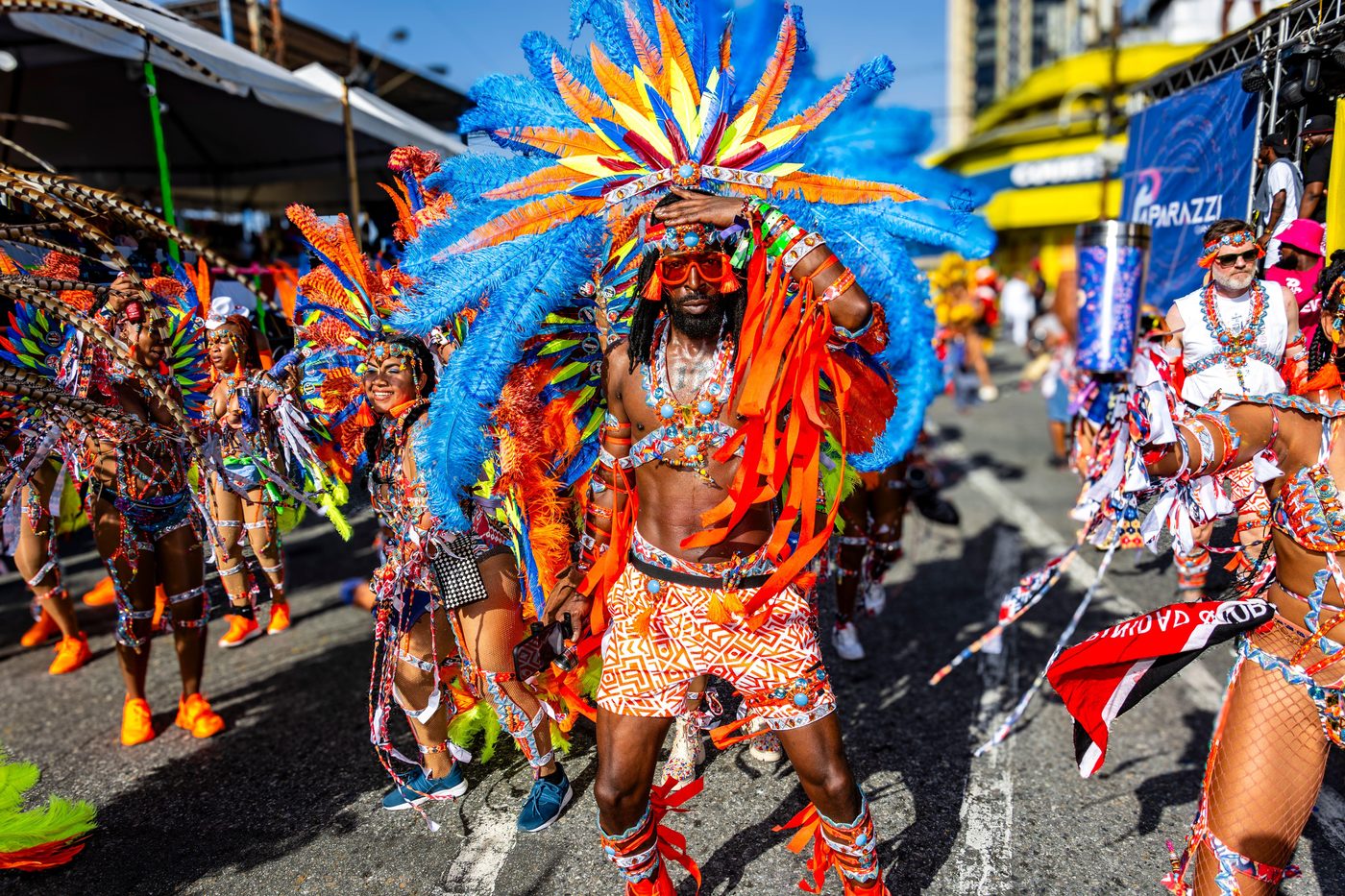 Masqueraders crossing the stage on Carnival Tuesday